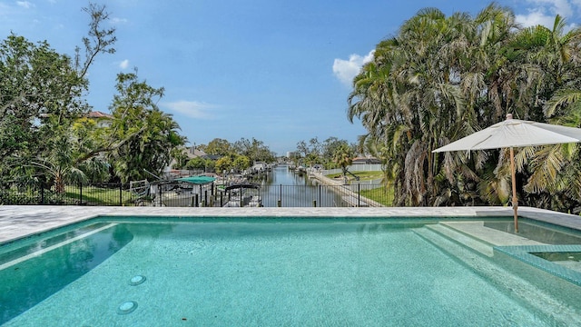view of pool featuring a fenced in pool and fence