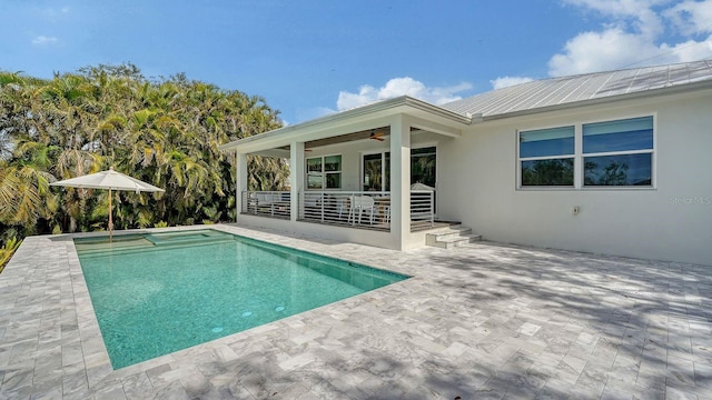 pool featuring a patio and ceiling fan