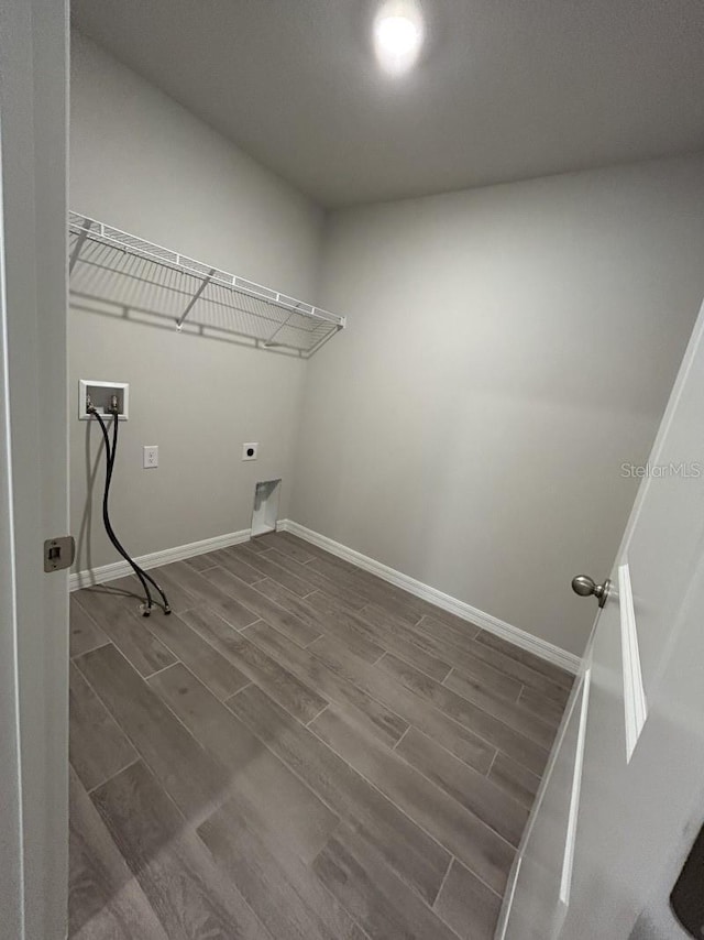 13633 NW 14th Pl, Newberry, FL 32669 - laundry room featuring hookup for a washing machine, laundry area, baseboards, dark wood finished floors, and electric dryer hookup