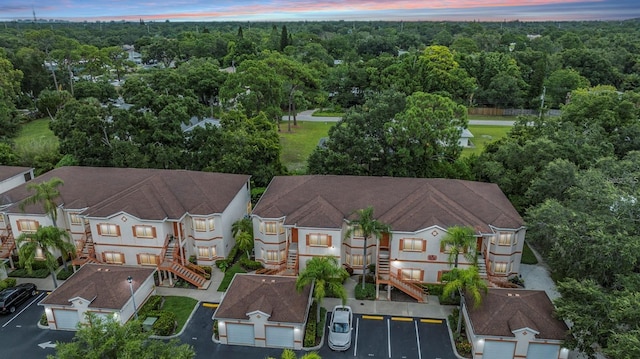 drone / aerial view featuring a view of trees