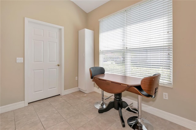 office featuring light tile patterned flooring and baseboards