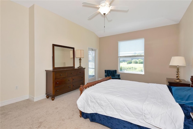 bedroom with a ceiling fan, lofted ceiling, light colored carpet, and baseboards