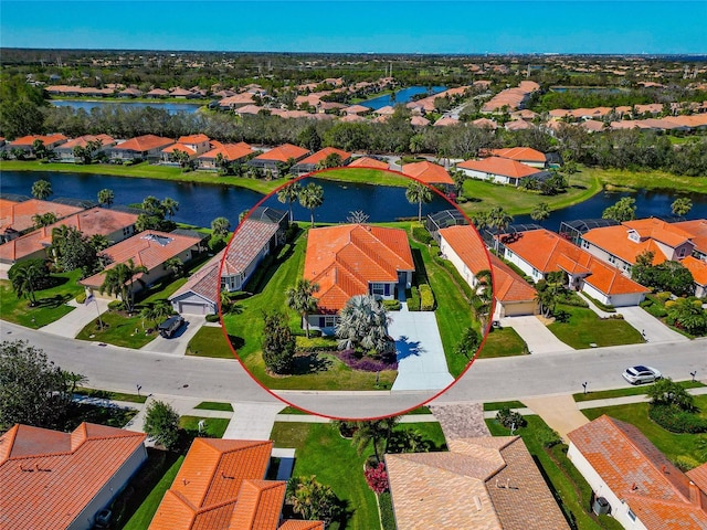 aerial view with a residential view and a water view