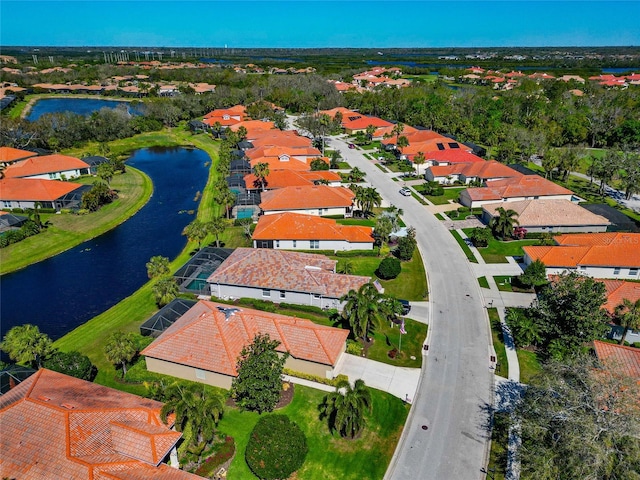 bird's eye view with a water view and a residential view