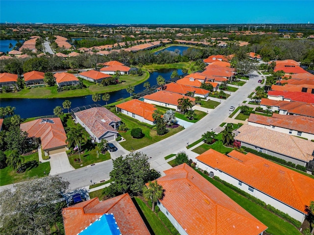 bird's eye view with a water view and a residential view