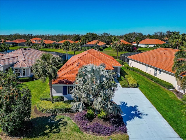 birds eye view of property with a residential view