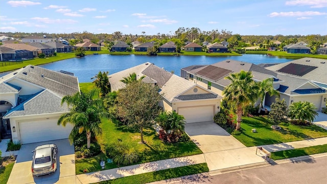 bird's eye view with a water view and a residential view