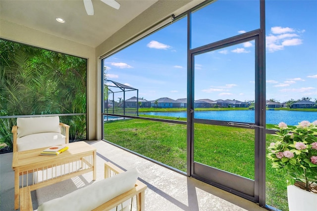 3838 Manorwood Loop, Parrish, FL 34219 - sunroom with a residential view, a water view, and ceiling fan