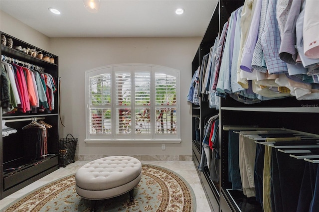 walk in closet featuring tile patterned flooring