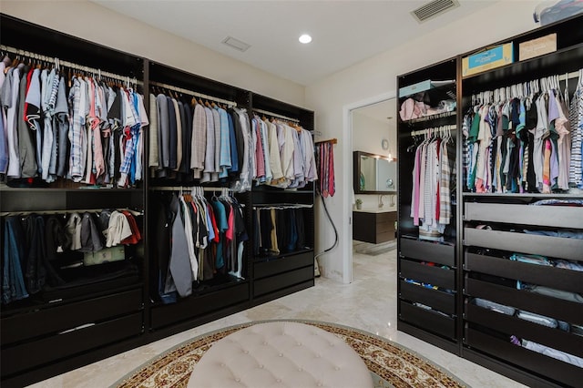 walk in closet featuring visible vents