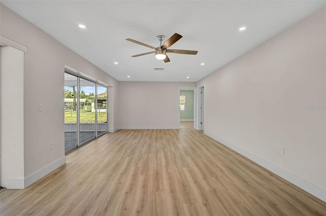 unfurnished living room with a ceiling fan, recessed lighting, light wood-style floors, and baseboards