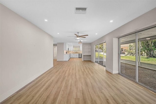 unfurnished living room featuring recessed lighting, baseboards, visible vents, and light wood finished floors