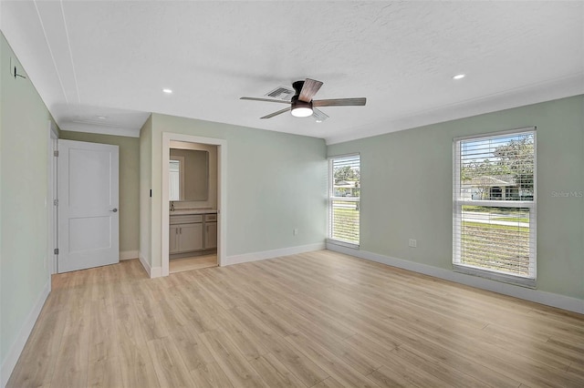 unfurnished bedroom featuring visible vents, baseboards, and light wood finished floors