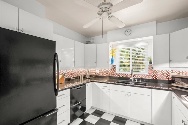 kitchen featuring black appliances, backsplash, a sink, and tile patterned floors