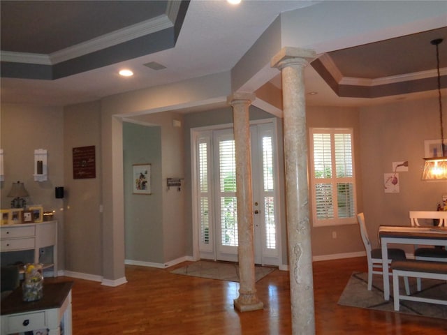 1354 Tearose Pl, Sarasota, FL 34239 - foyer featuring a raised ceiling, decorative columns, and ornamental molding