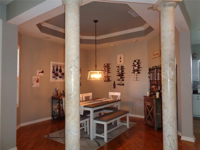 1354 Tearose Pl, Sarasota, FL 34239 - dining area with a raised ceiling, ornate columns, and wood finished floors