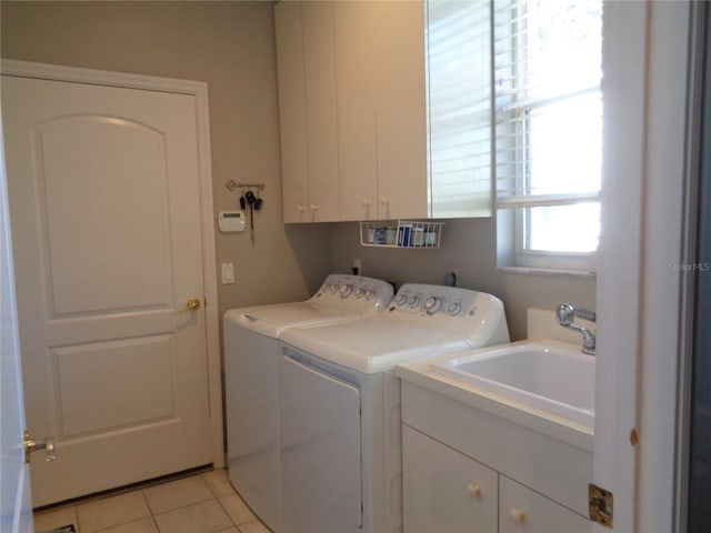 1354 Tearose Pl, Sarasota, FL 34239 - clothes washing area with light tile patterned floors, cabinet space, separate washer and dryer, and a sink