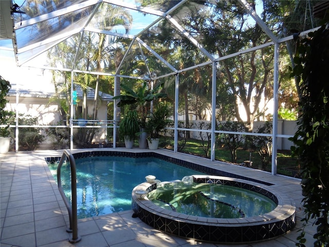 1354 Tearose Pl, Sarasota, FL 34239 - view of swimming pool featuring glass enclosure, a pool with connected hot tub, and a patio area