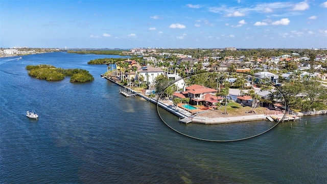 bird's eye view featuring a water view and a residential view