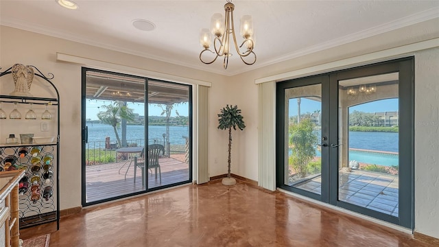 entryway featuring baseboards, ornamental molding, a water view, french doors, and concrete floors