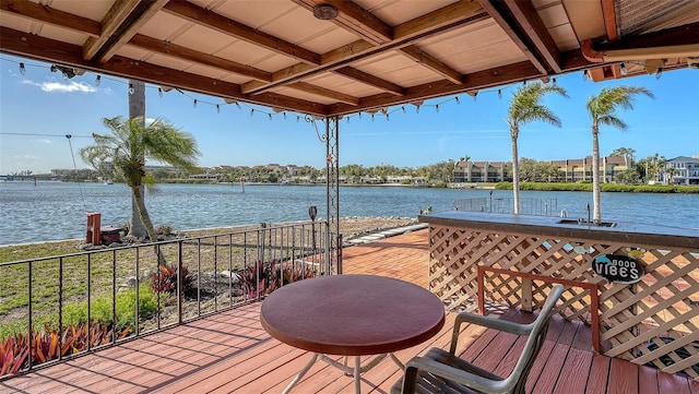 wooden deck with a water view