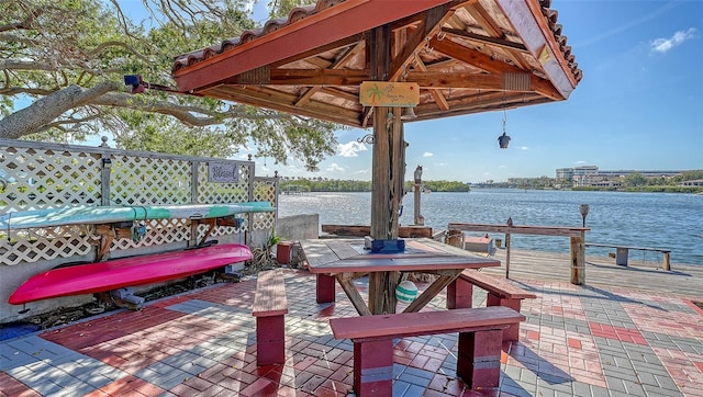 view of patio with a water view and a gazebo