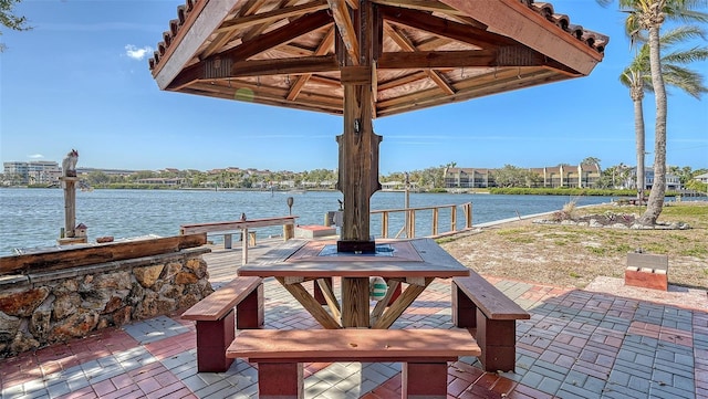 view of patio featuring a water view and a gazebo