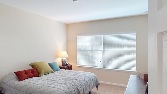 carpeted bedroom with baseboards