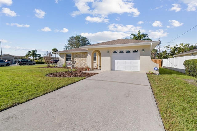 ranch-style home featuring stucco siding, concrete driveway, an attached garage, a front yard, and fence