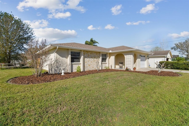 ranch-style house with a front yard, concrete driveway, an attached garage, and stucco siding