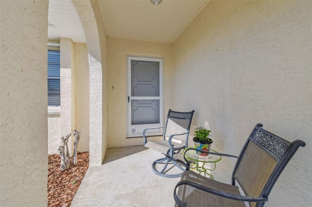 doorway to property with stucco siding