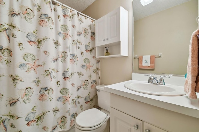 full bath featuring curtained shower, a textured ceiling, toilet, and vanity