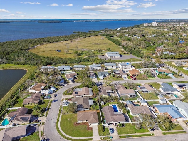 bird's eye view with a water view and a residential view