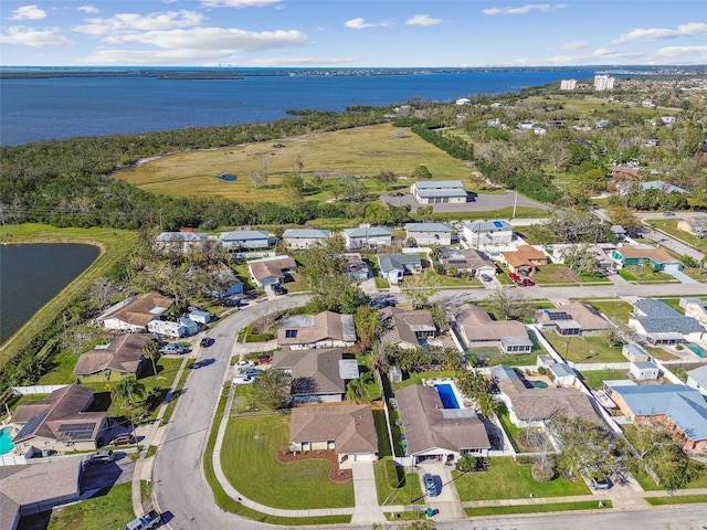 bird's eye view with a water view and a residential view