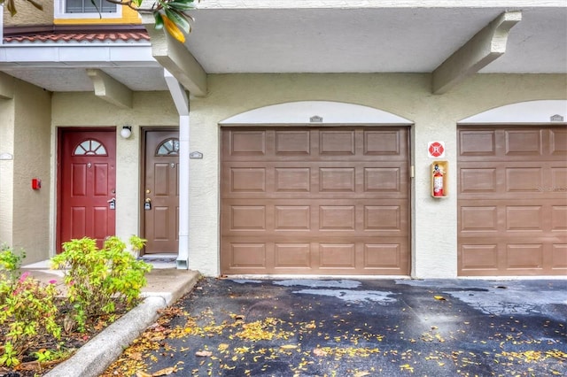 garage featuring driveway