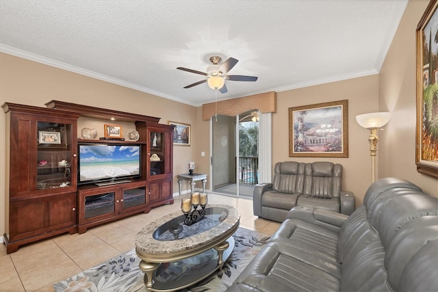 living area with light tile patterned floors, a textured ceiling, crown molding, and ceiling fan