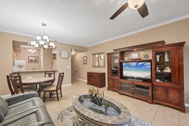 living area with light tile patterned floors, baseboards, a textured ceiling, and ornamental molding