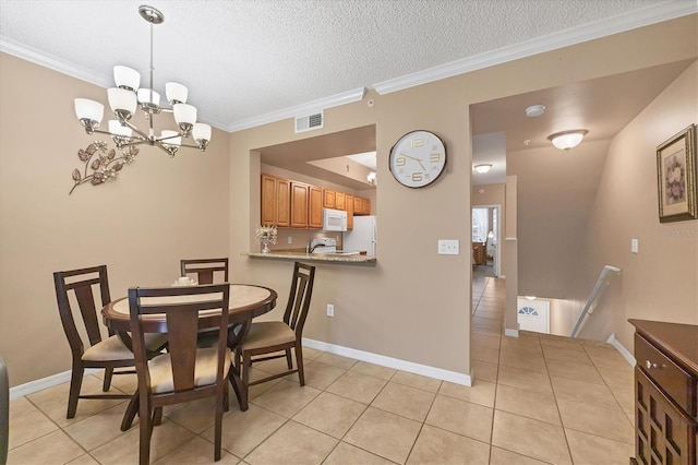 dining space with visible vents, baseboards, ornamental molding, light tile patterned flooring, and a textured ceiling