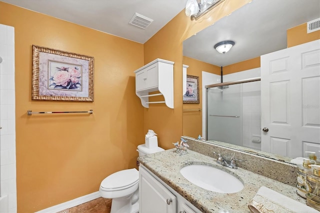 bathroom with vanity, visible vents, baseboards, an enclosed shower, and toilet