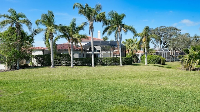 view of yard featuring a lanai