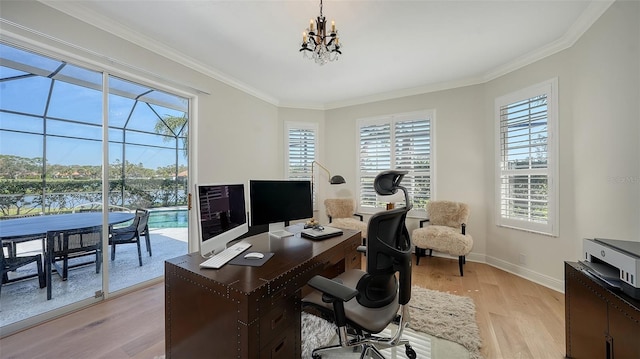 office with baseboards, light wood-style floors, a chandelier, and crown molding