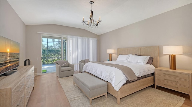 bedroom with an inviting chandelier, access to exterior, light wood-type flooring, and lofted ceiling