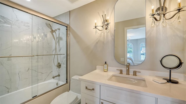 full bath featuring vanity, toilet, and enclosed tub / shower combo