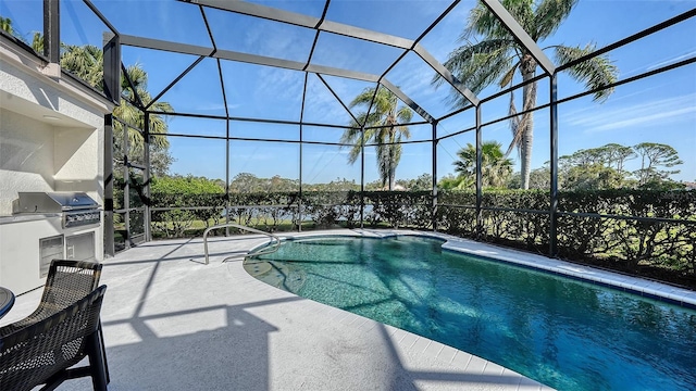 view of pool with glass enclosure, a patio, and area for grilling