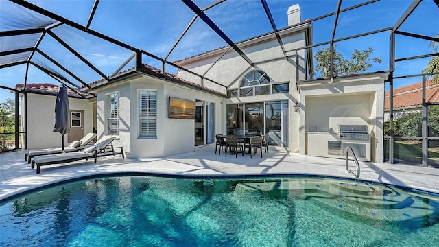 pool with grilling area, area for grilling, glass enclosure, and a patio