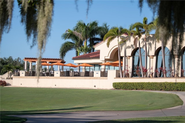 surrounding community featuring a pergola and a yard