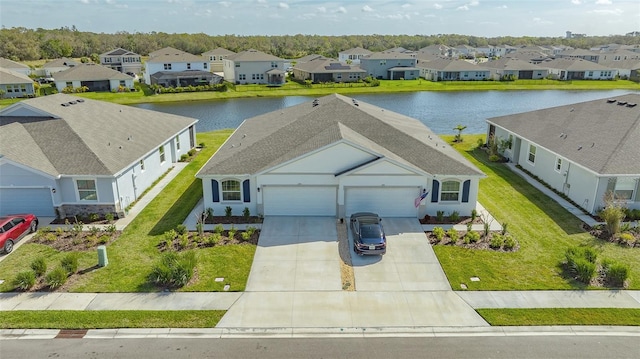 aerial view with a water view and a residential view