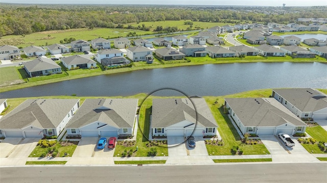 aerial view with a water view and a residential view