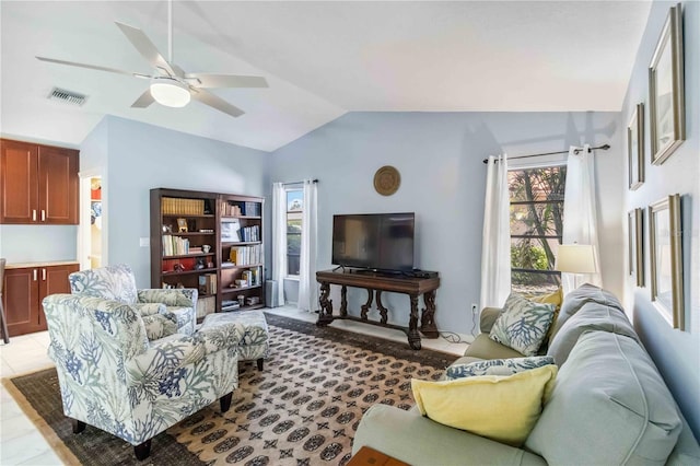 living room featuring lofted ceiling, a ceiling fan, and visible vents