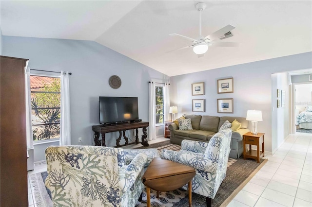 living room featuring vaulted ceiling, light tile patterned floors, a healthy amount of sunlight, and visible vents